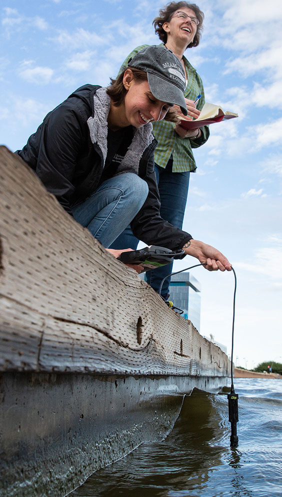 ASU student taking water samples at Tempe Town Lake as part of the Central Arizona–Phoenix Long-Term Ecological Research project