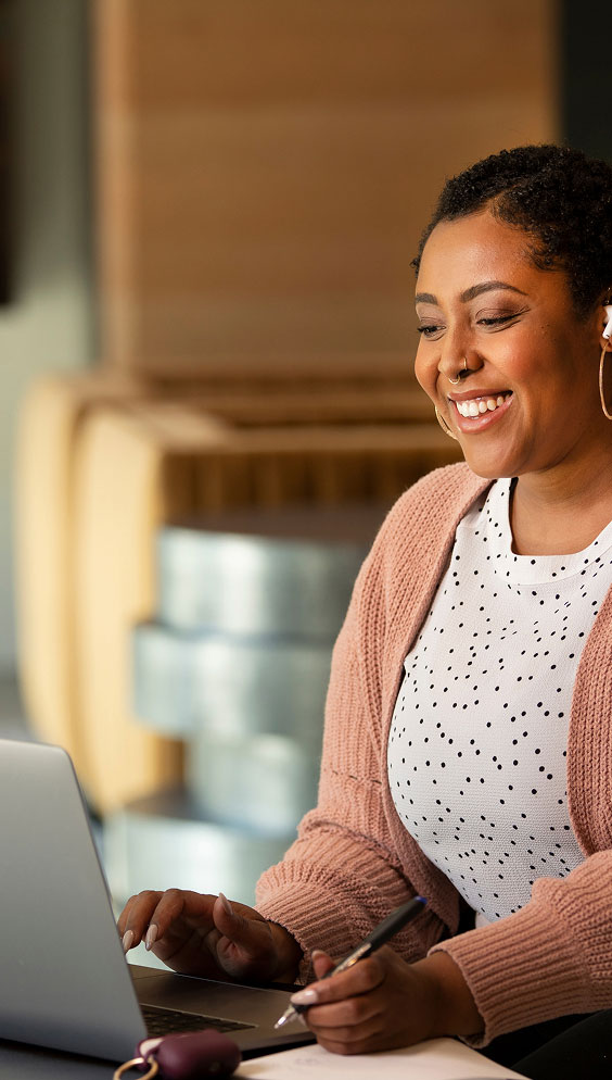 ASU alumna working on computer